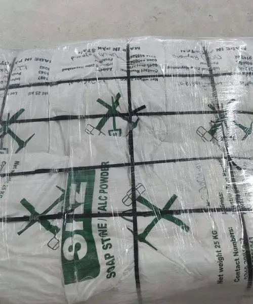 A shrink-wrapped stack of printed SKZ soap stone and talc powder bags